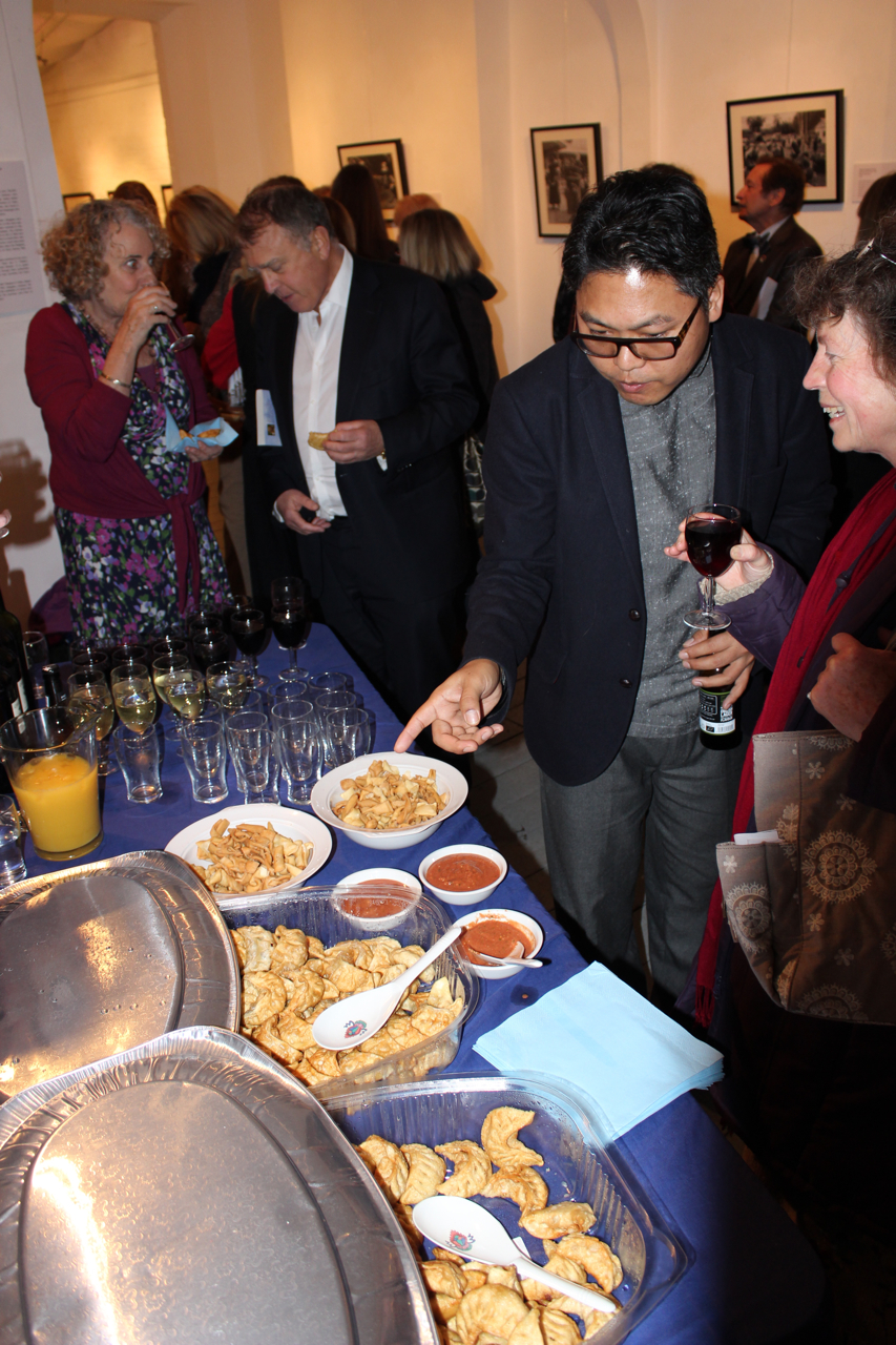 The opening reception - guests enjoy tradtitional Tibetan momos